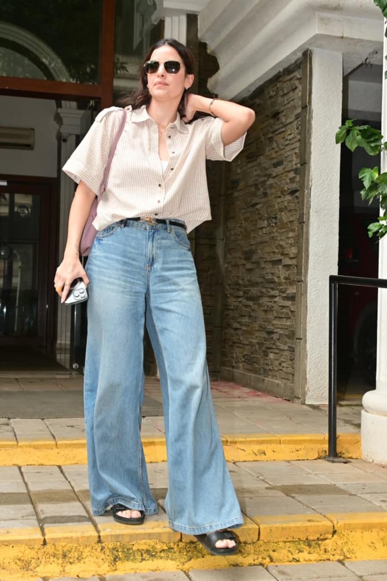 Natasa Stankovic was spotted in a chic yet laid-back look, perfect for a casual outing. She paired a striped oversized shirt with wide-leg blue jeans